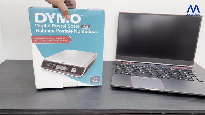 Unbox the Dymo M25 scale and inspect for damage.