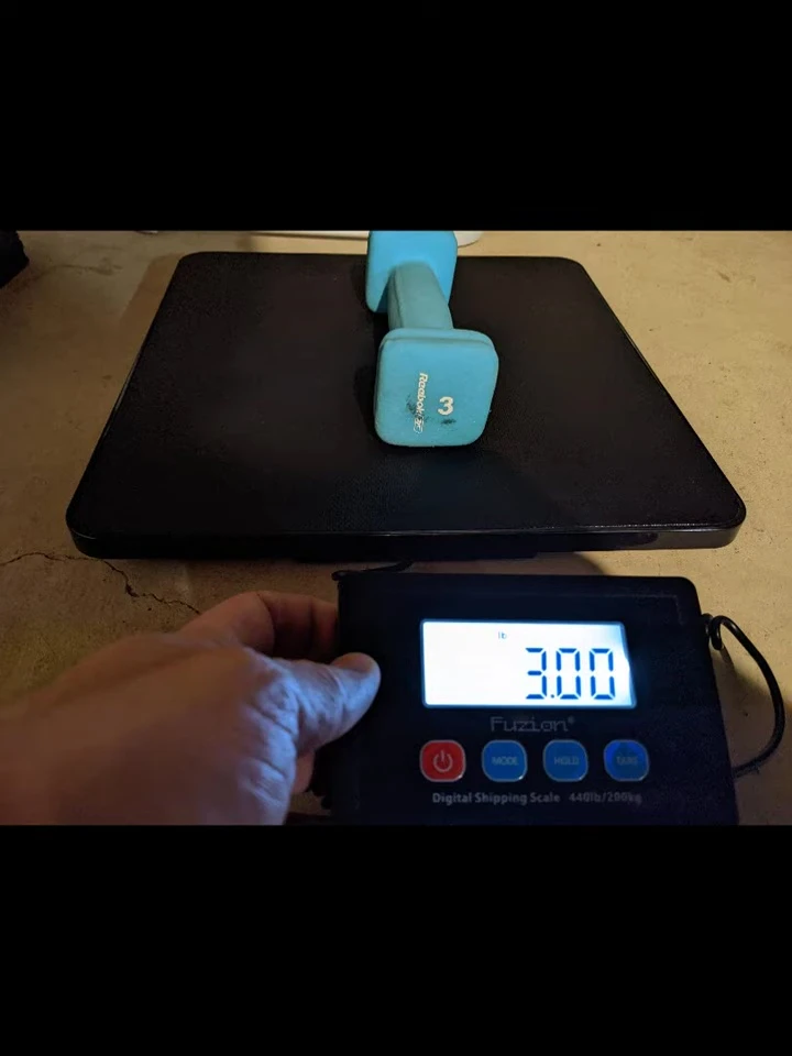 The scale displaying the weight of a heavier test object.
