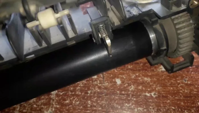 Reassemble the photocopier in reverse order of disassembly, ensuring all components are correctly placed and secured.