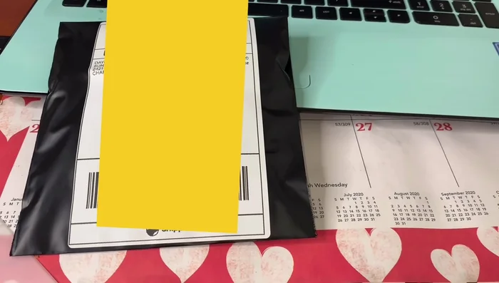 Attach the label to the package and drop it off at the post office.