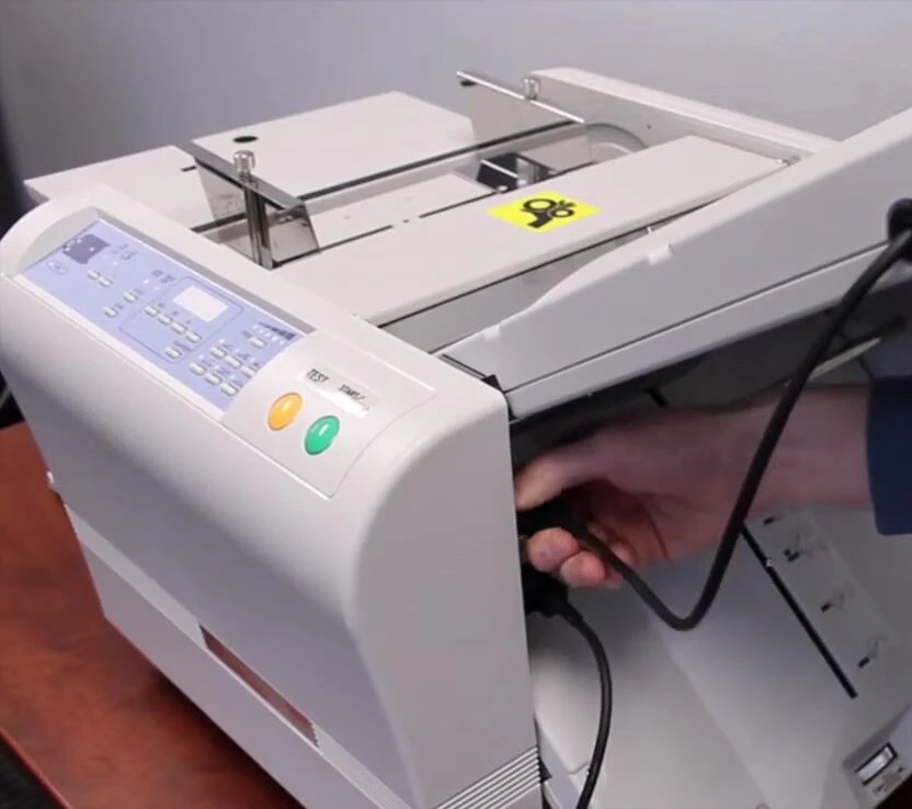 Removing a folding tray for access to rollers.