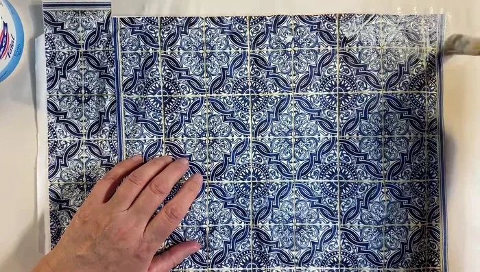 Apply a second coat of glue: After smoothing the napkin, apply another layer of watered-down glue over the entire surface to seal and ensure durability.