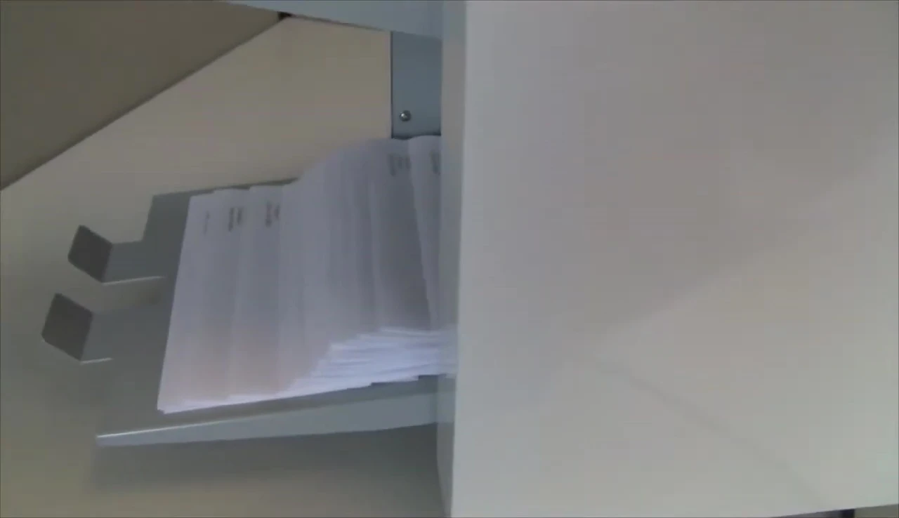 A shot highlighting the dimensions of documents the machine can fold.