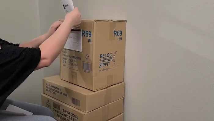 Insert your packing list and any invoices into the top of the envelope.