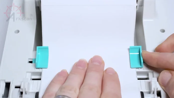 Push the sliders together gently until they just touch the labels.