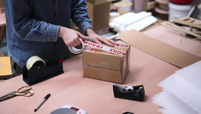 Final steps: Weigh and measure each box, recording information on the outside. Complete online order details and print labels.