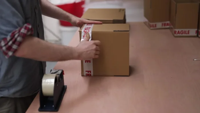 Final steps: Weigh and measure each box, recording information on the outside. Complete online order details and print labels.