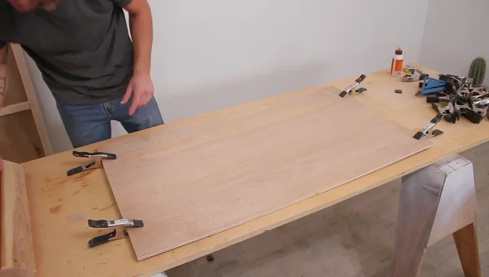 Attach the base to the frame using screws.