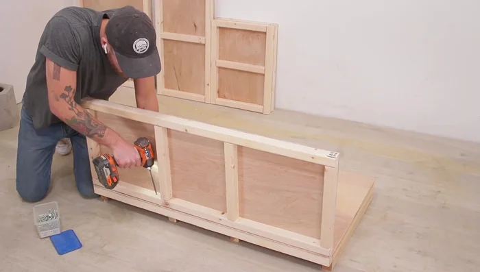 Attach the base to the frame using screws.