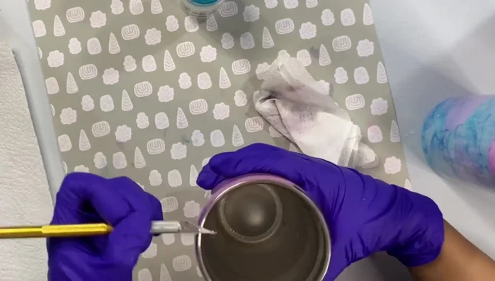 For stubborn paint, use Goo Gone on a paper towel or Magic Eraser.