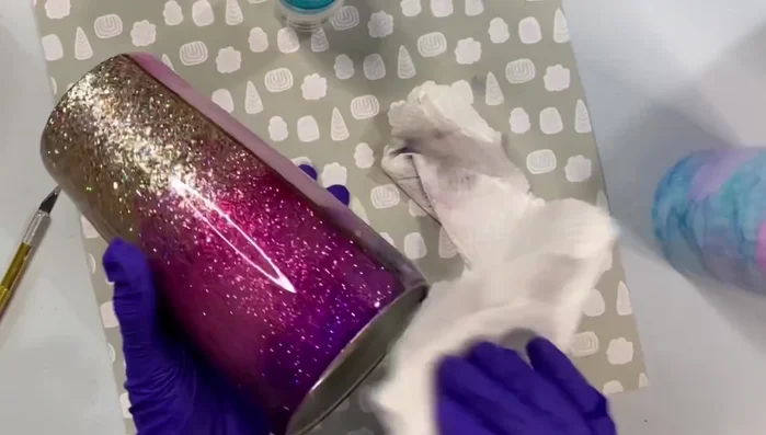 Wash the tumbler thoroughly with soap and water to remove any acetone or Goo Gone residue.