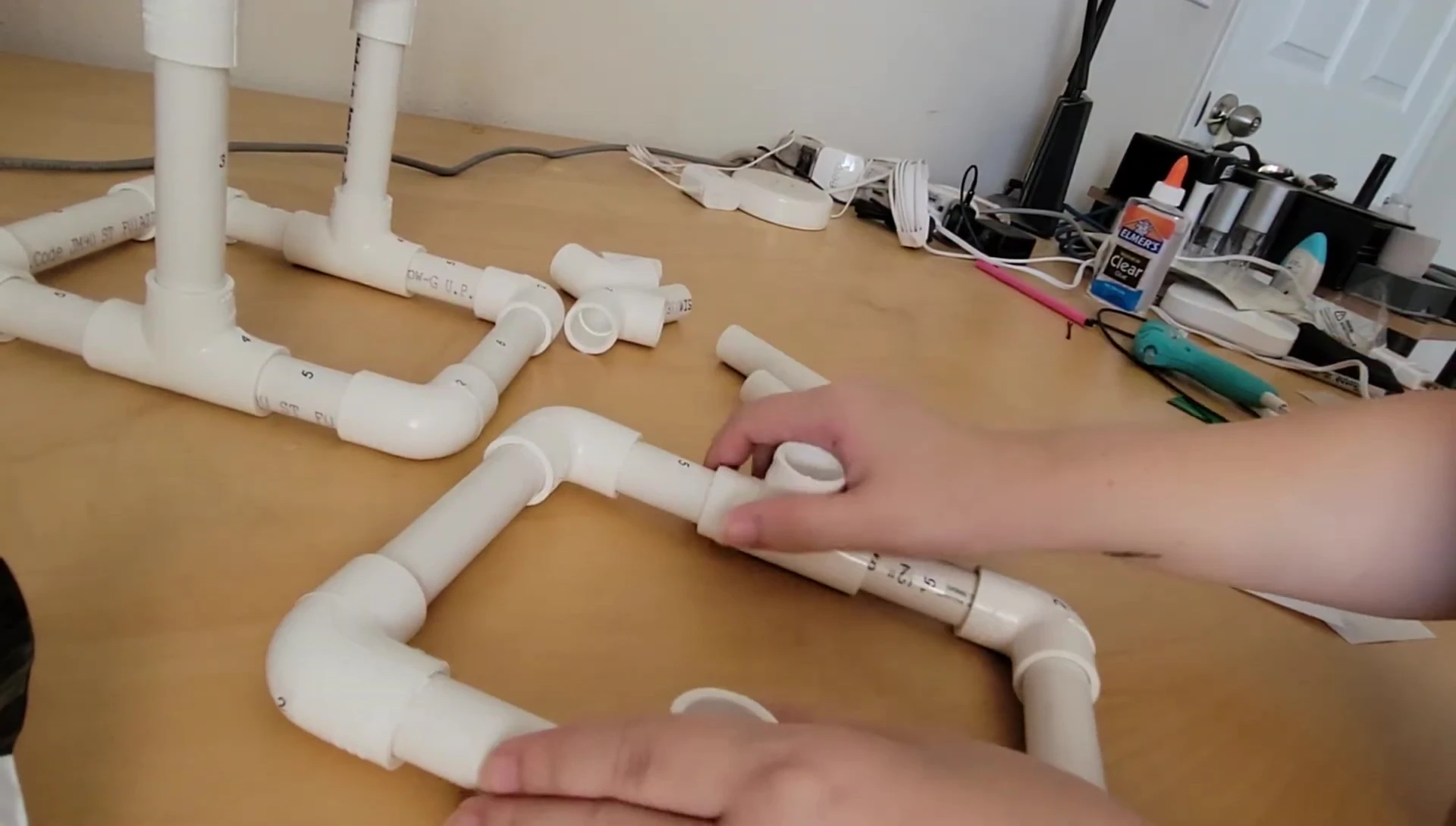 Attaching the top pieces, showing the T-fitting