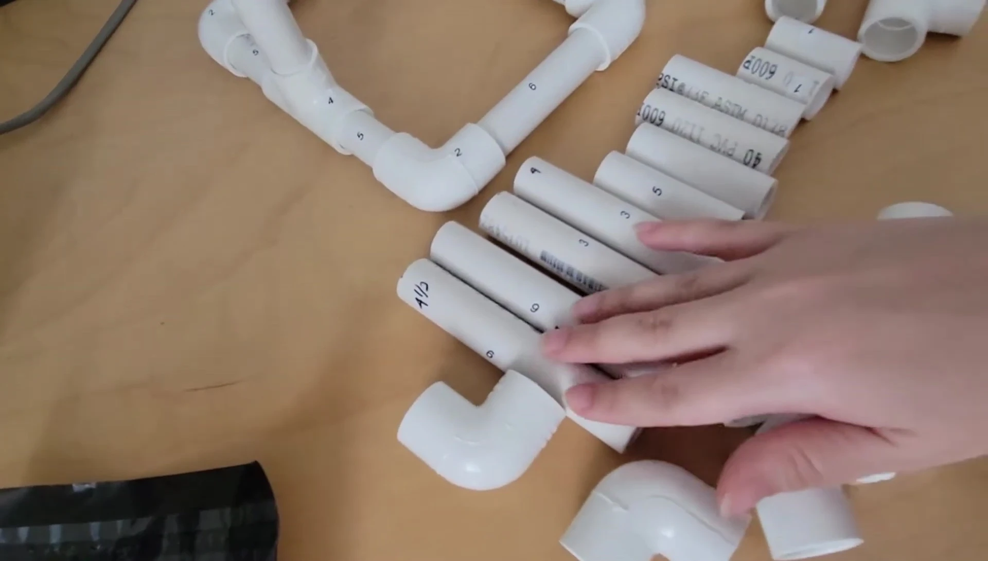 Detailed view of the different sized PVC pieces with their corresponding numbers