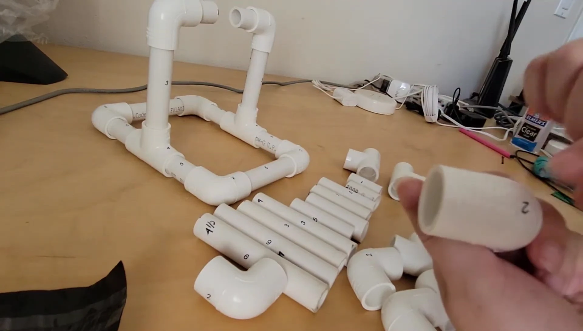 The narrator pointing at the elbow and 4-inch pipe