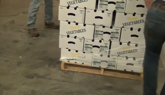 Secure the bottom layer to the pallet with two full wraps around the pallet, securing it to the wooden part.