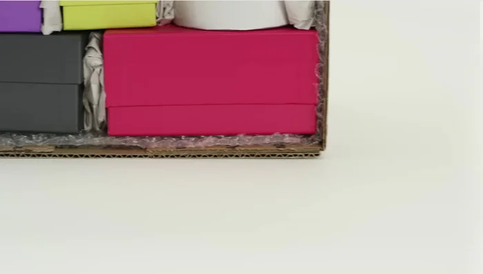 Fill empty spaces in the box with additional packing materials.