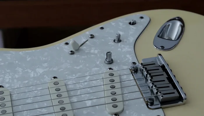 Reattach screws to the knobs.