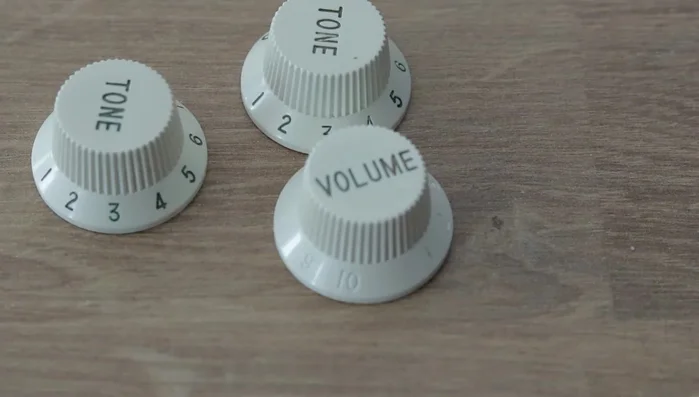 Clean knobs with WD-40 contact cleaner. Note: This may remove ink from some knobs, but not all.