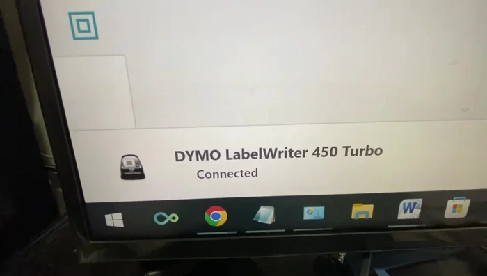 Release the reset button. The printer should now reconnect.