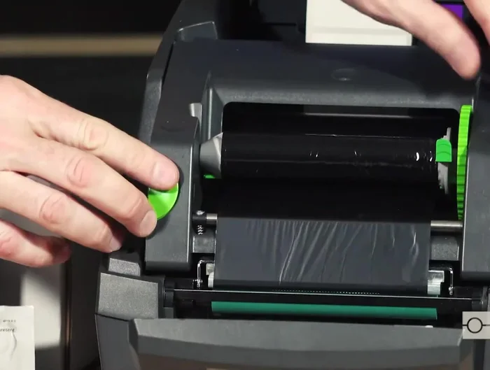 Remove the label roll and ribbon from the printer.