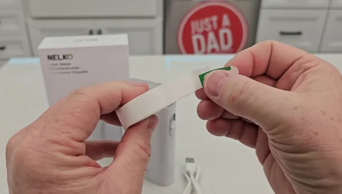 Remove the protective label from the printer tape. If it's difficult to remove cleanly, tear it off.