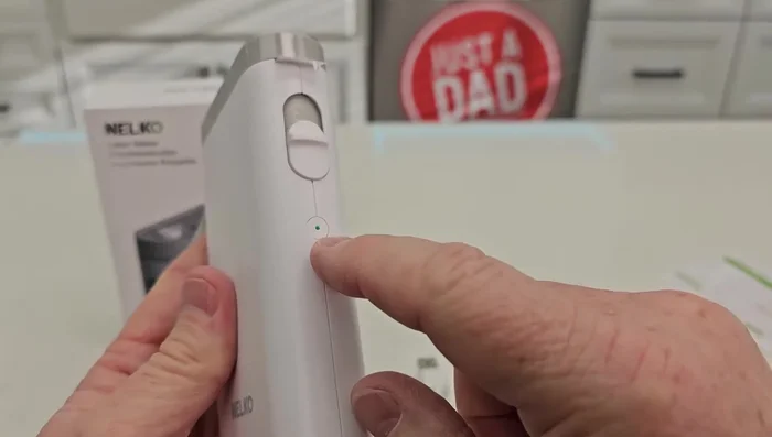 The label maker will calibrate automatically. A single tap of the button initiates the calibration and printing of a test label.