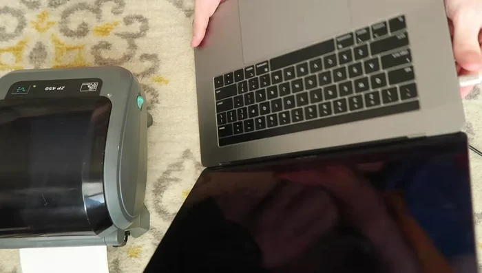 Connect the printer to your Mac using a USB-C to USB-A adapter.