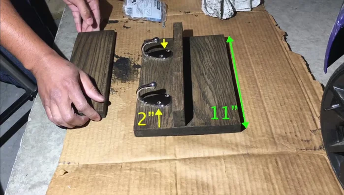 Secure the hooks to the main board using screws.