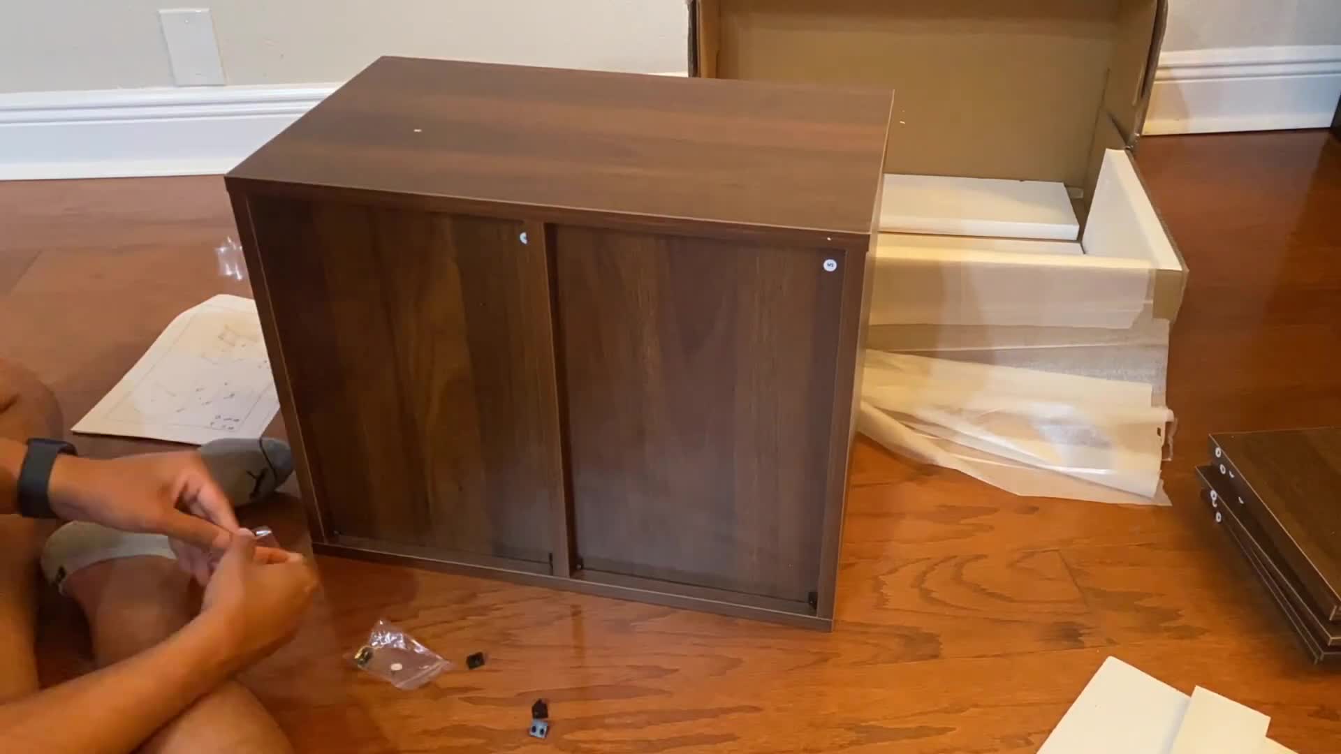 Close-up shot of the organizer showing the adjustable shelves and multiple compartments.