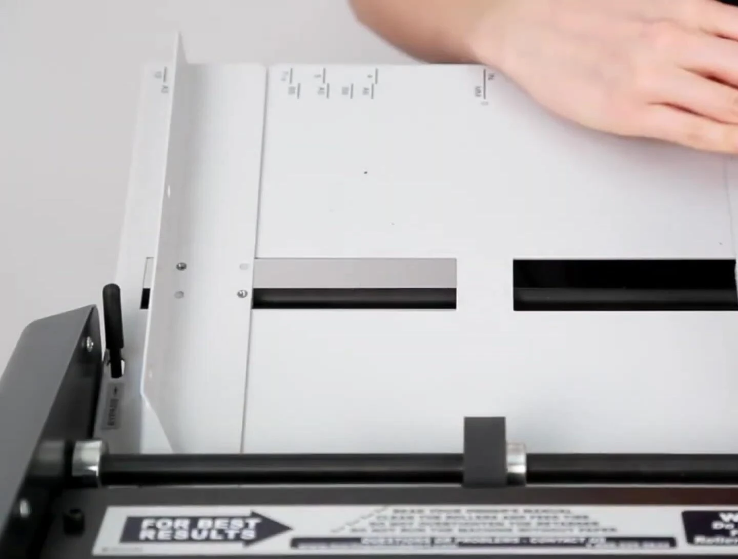 A detailed view of the paper guides on the feed table assembly.