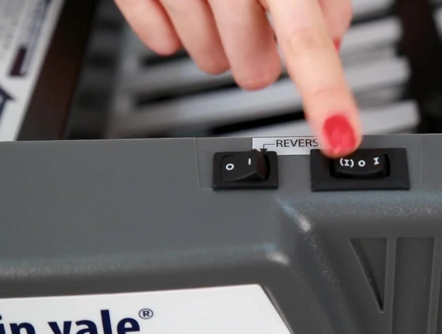 Close-up of the rocker switch on the Martin Yale 1217A AutoFolder.