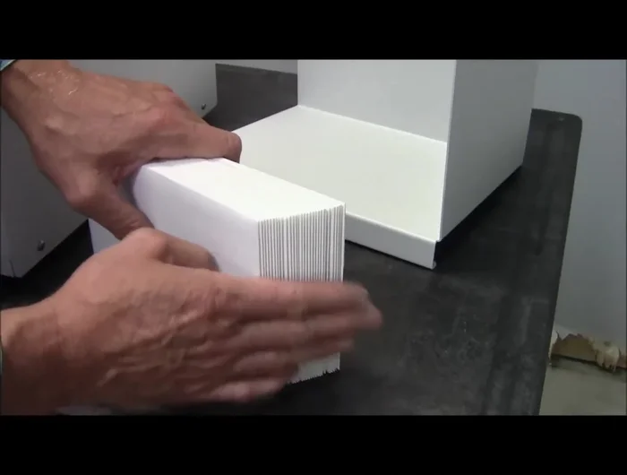 Loading the Hopper: Tap down envelopes into the hopper at a slight angle, with the flap at the back and down. Ensure they follow the wedge at the back and the gate cylinder at the front.