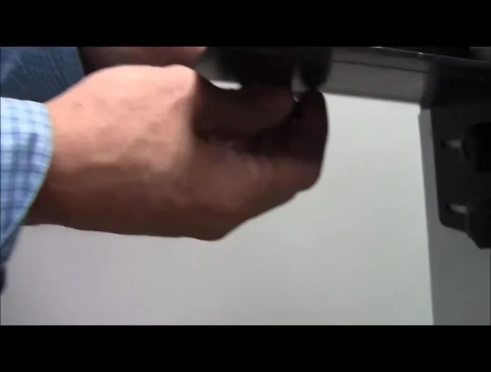 Adjusting the Wedge: Loosen the angle bracket holding the wedge, and adjust it to hold the envelope slightly off the deck. This provides necessary play for smooth feeding.