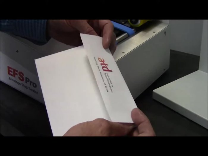 Loading the Hopper: Tap down envelopes into the hopper at a slight angle, with the flap at the back and down. Ensure they follow the wedge at the back and the gate cylinder at the front.