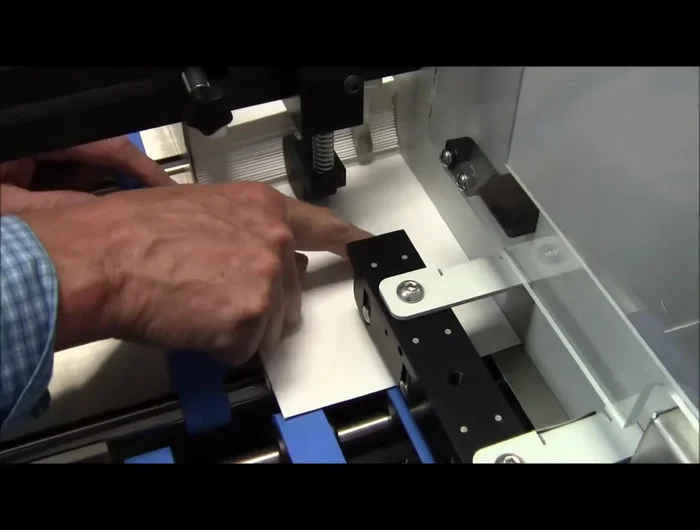 Final Feeding Check: Verify that the top of the envelope is against the back of the feeder. Observe the envelope falling smoothly into the cracking mechanism.