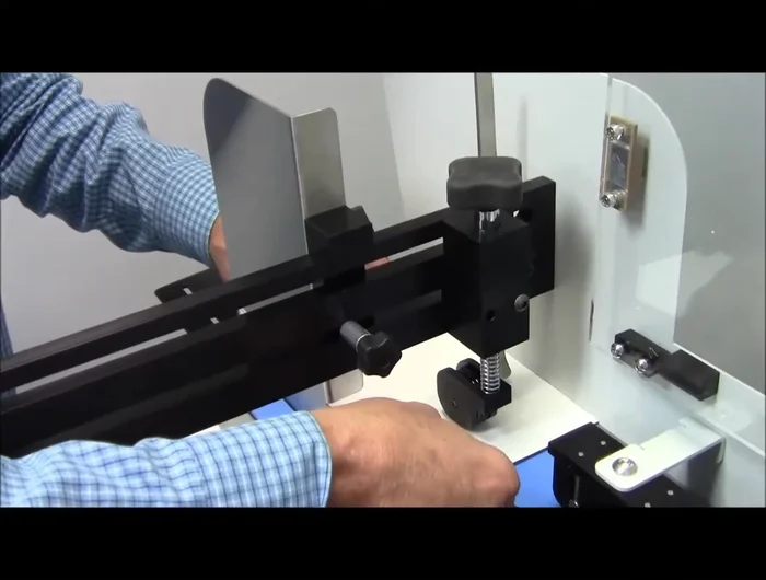 Adjusting the Gate and Separator: Place one envelope under the O-ring separator, add a second, and slide them back and forth. Lower the gate until you feel resistance on the top envelope, ensuring only one passes through at a time.