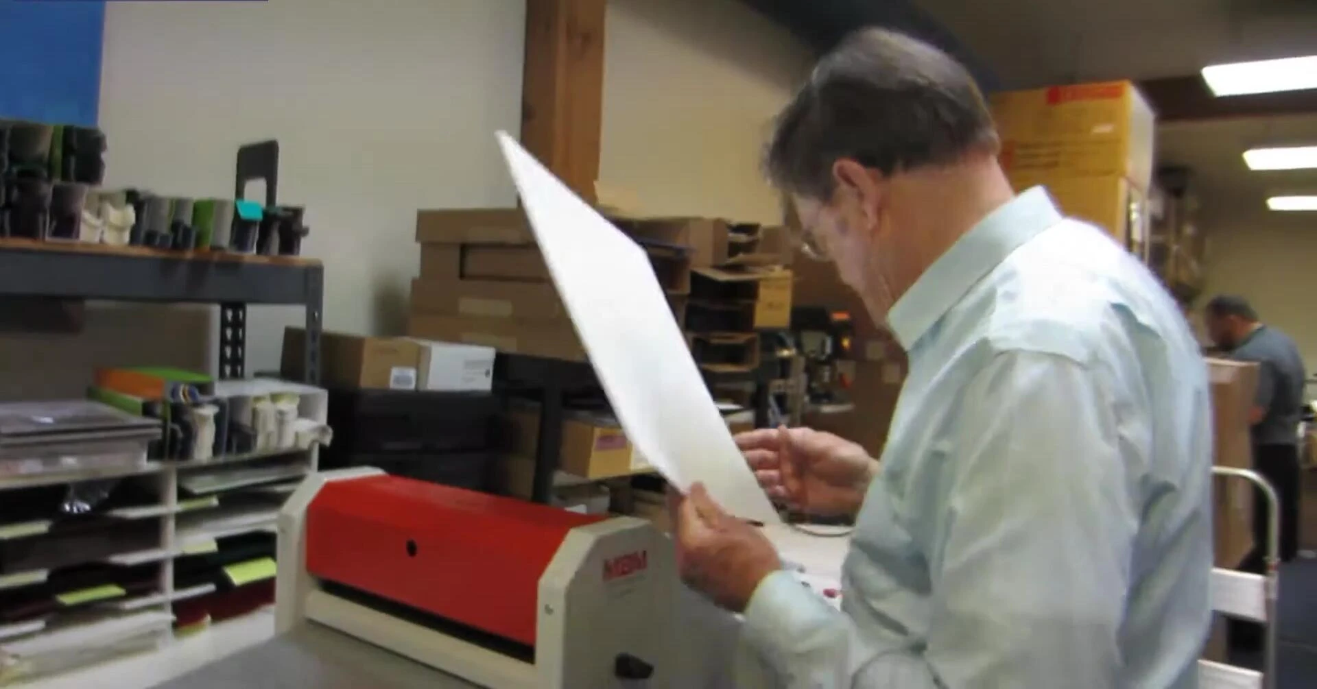 The machine performing a gate fold.