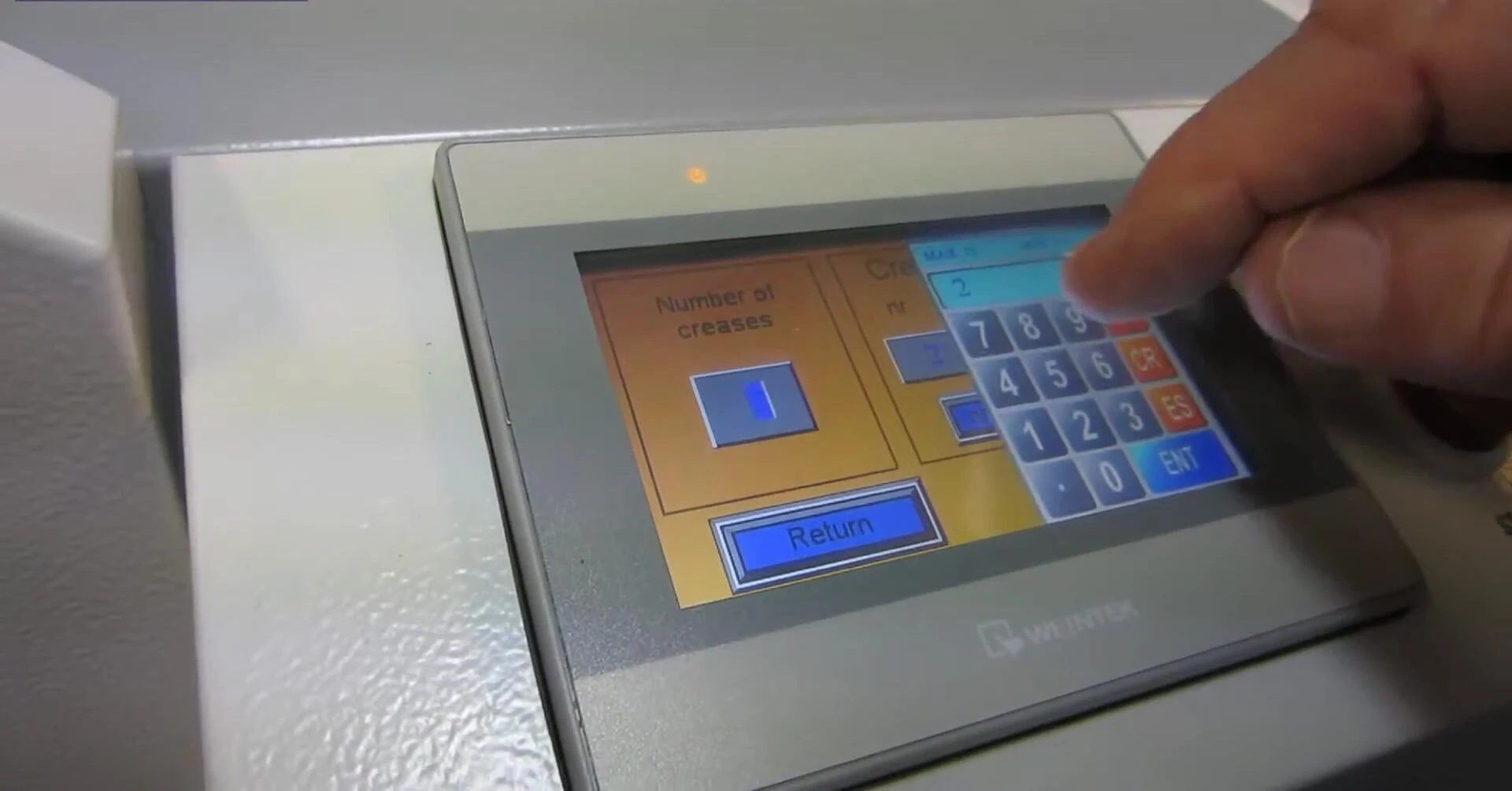Touchscreen showing the crease programming interface.