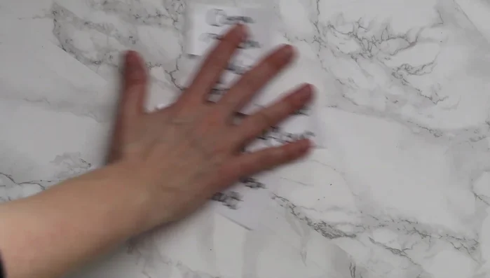 Submerge labels in lukewarm water for about 1.5 minutes.