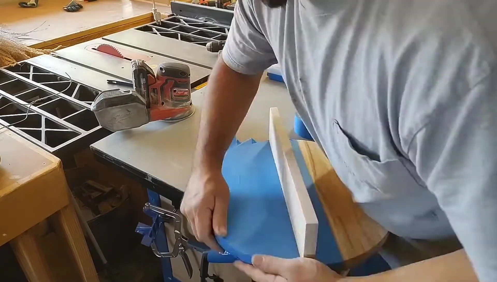 Taping off the shelf before painting.