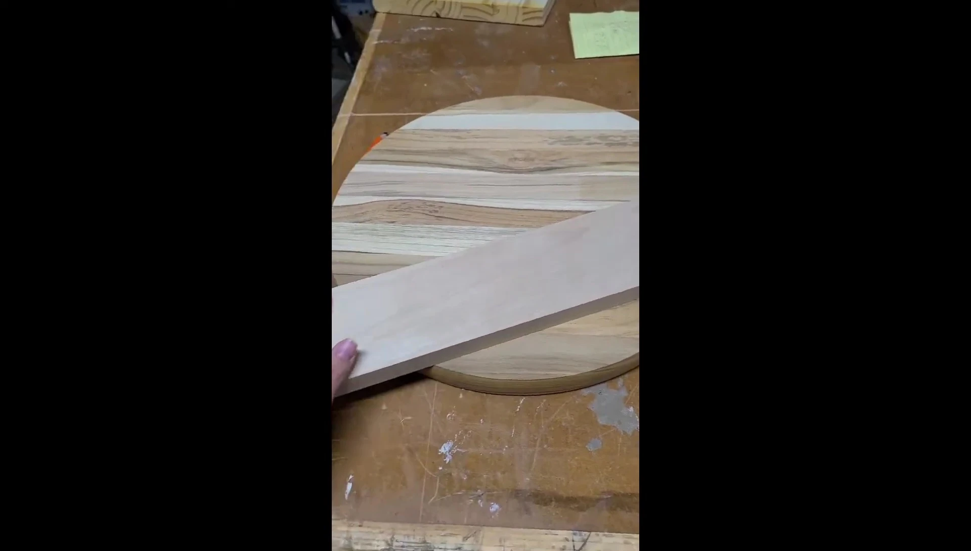 The 1x4 piece of scrap wood that will be used as the shelf.