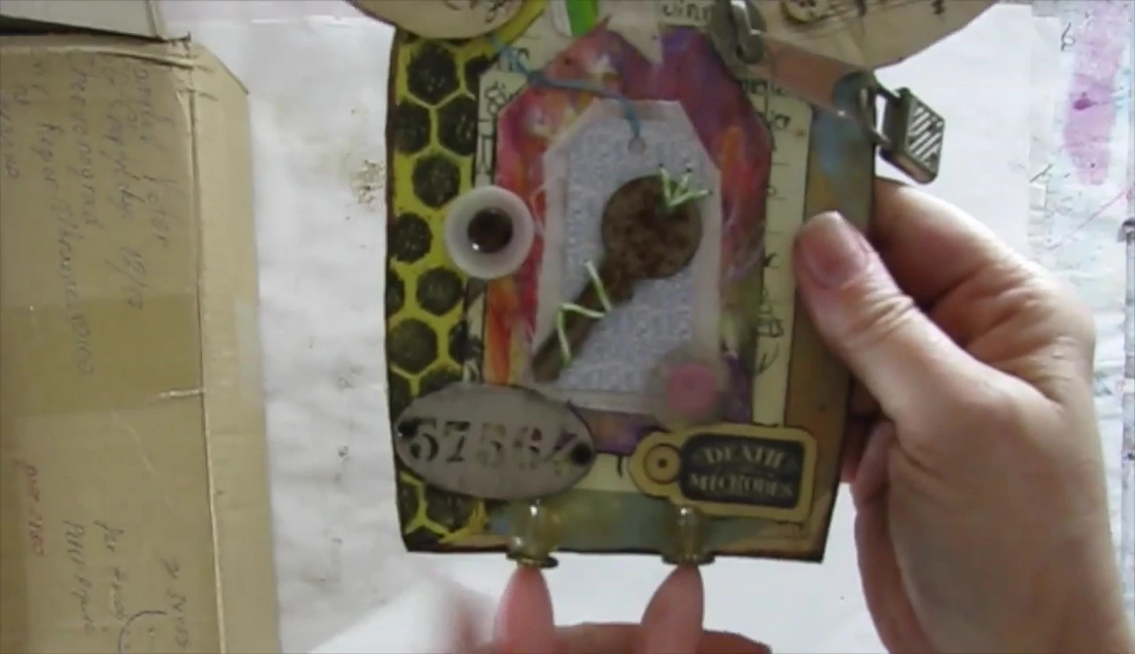 Close-up of the whimsical bird and fabric doll.