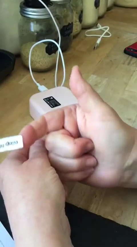 Demonstrating the plastic label's durability.