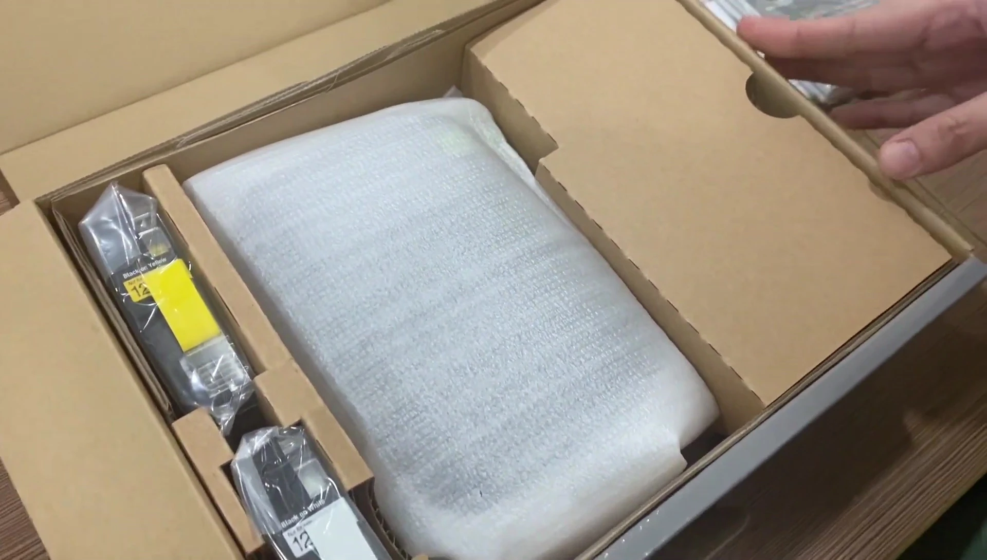 Close-up of the instruction manual and AC adapter.