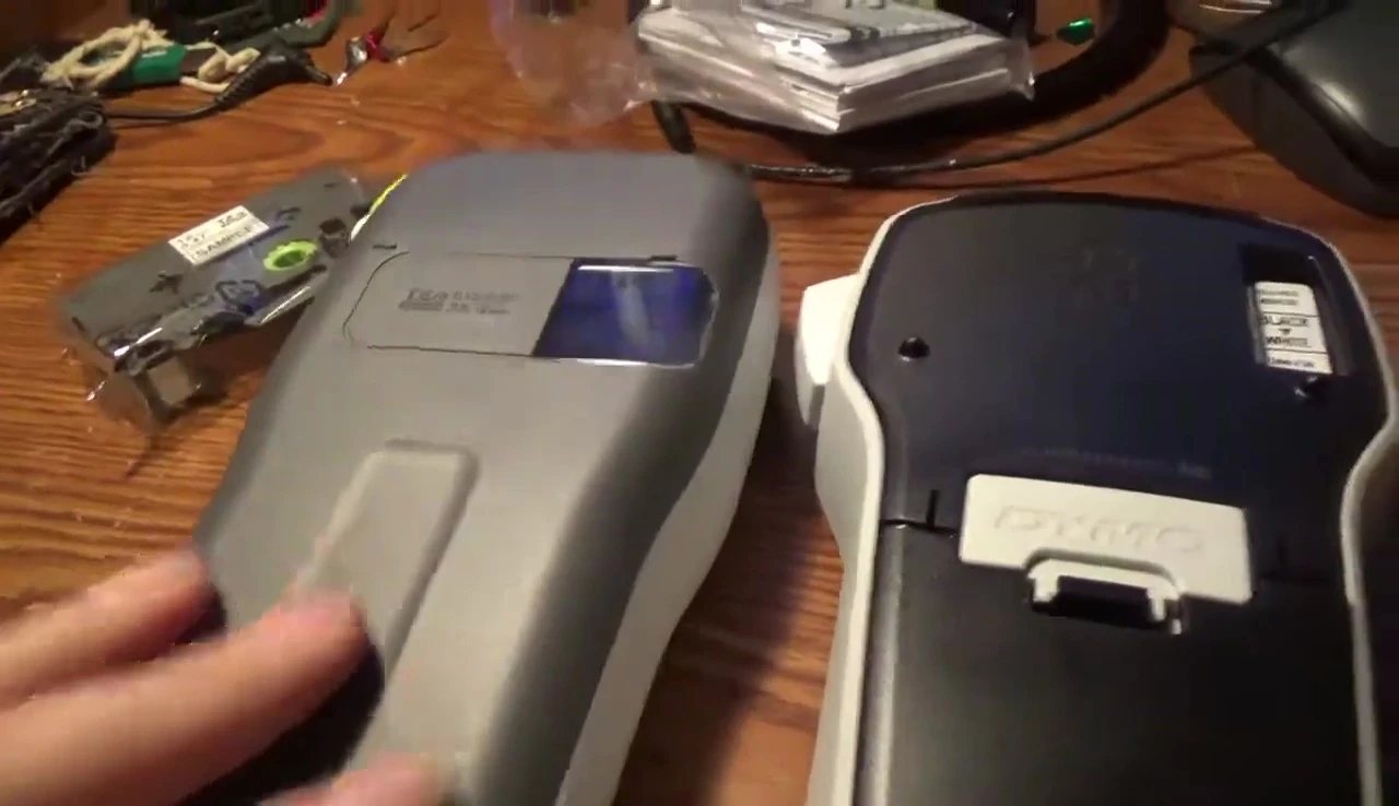 Demonstrating the tape loading process on the Brother P-touch