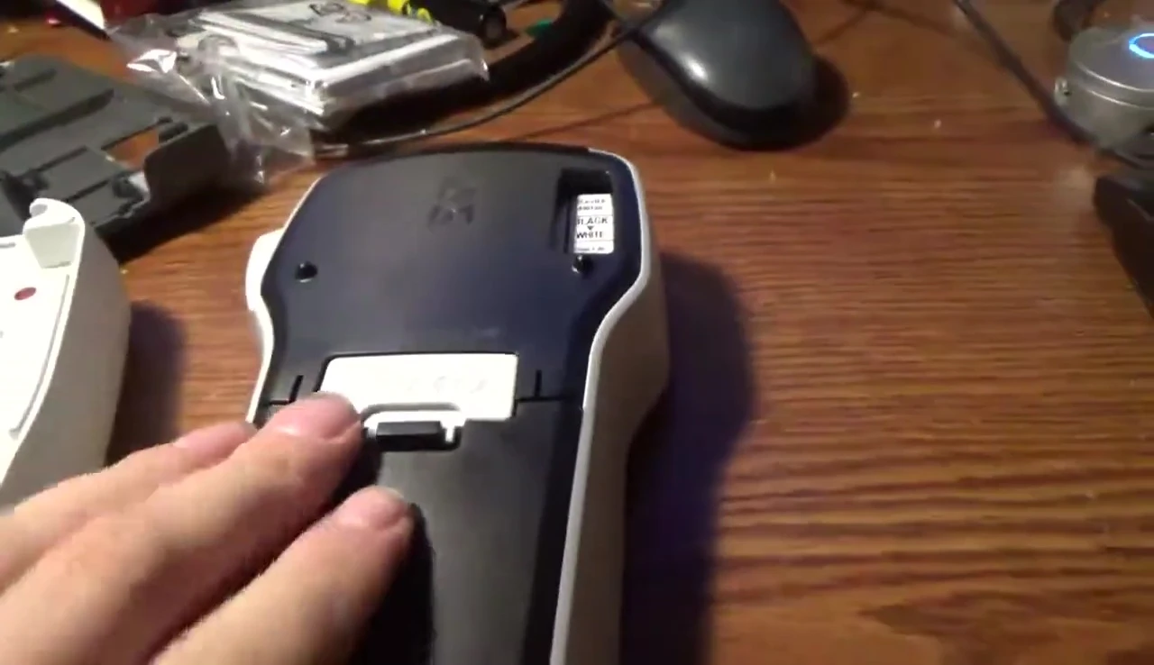 Comparison of battery and tape access on DYMO and Brother