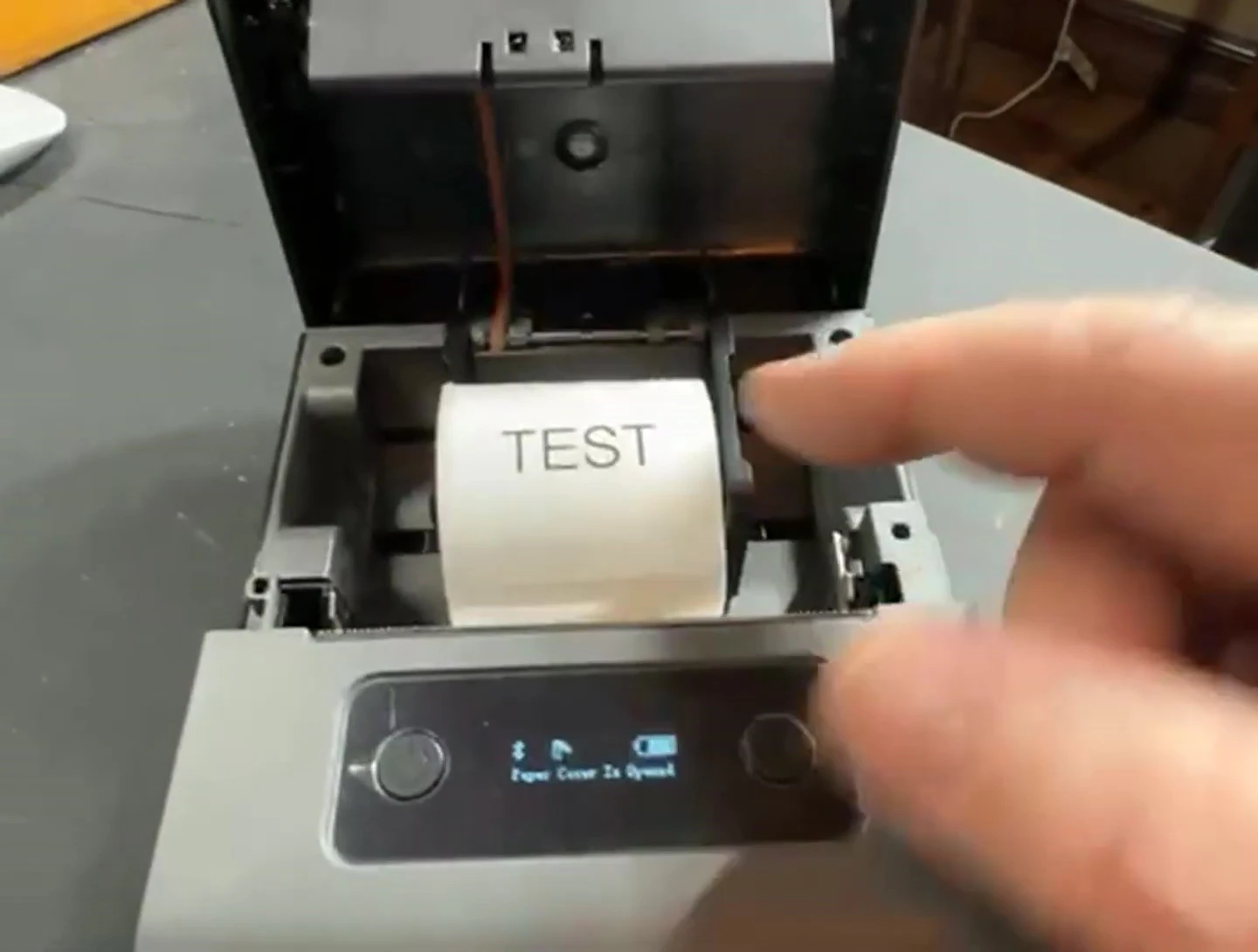 Demonstration of replacing a label roll.