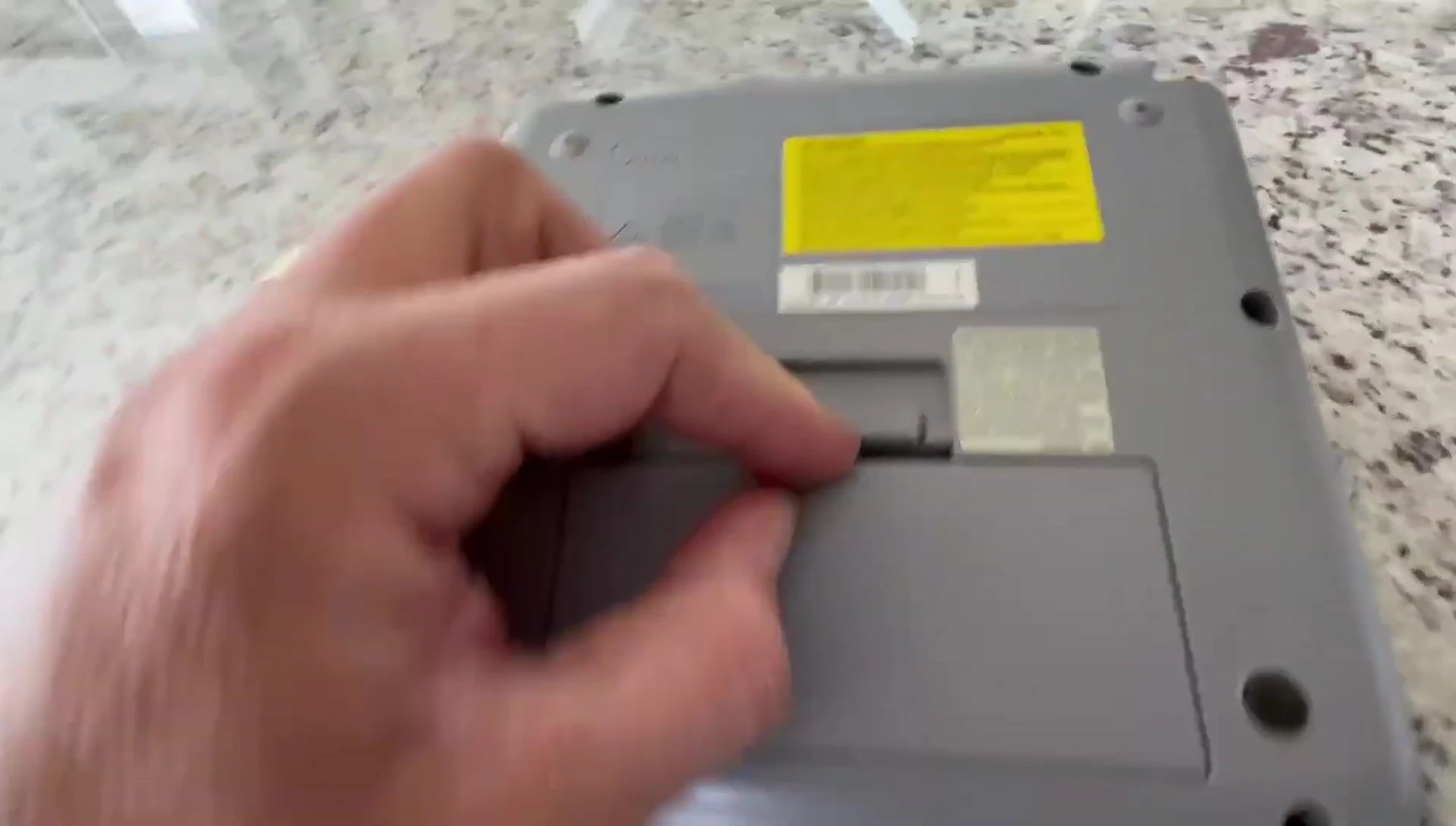 The reviewer holding the P-Touch PTD210 label maker.