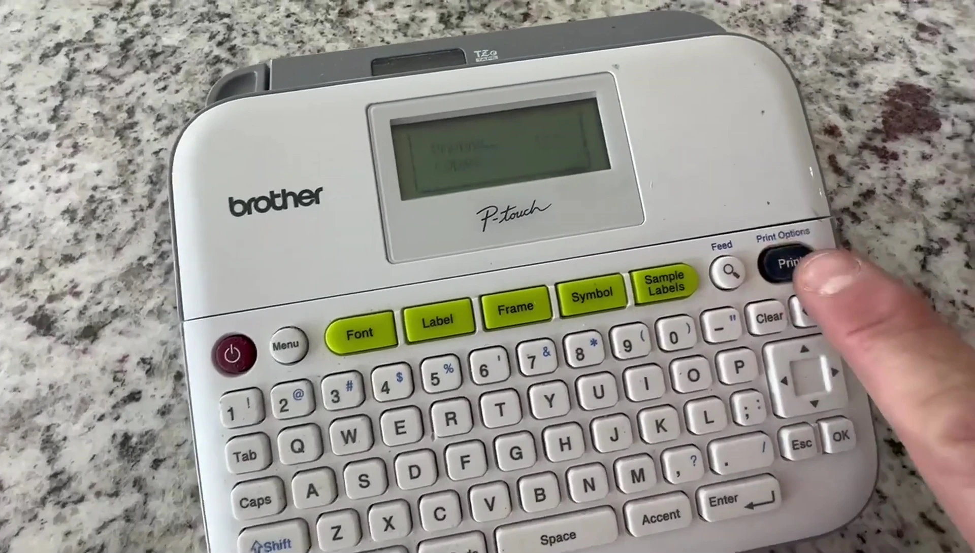The label printing process, showcasing the label exiting the machine.