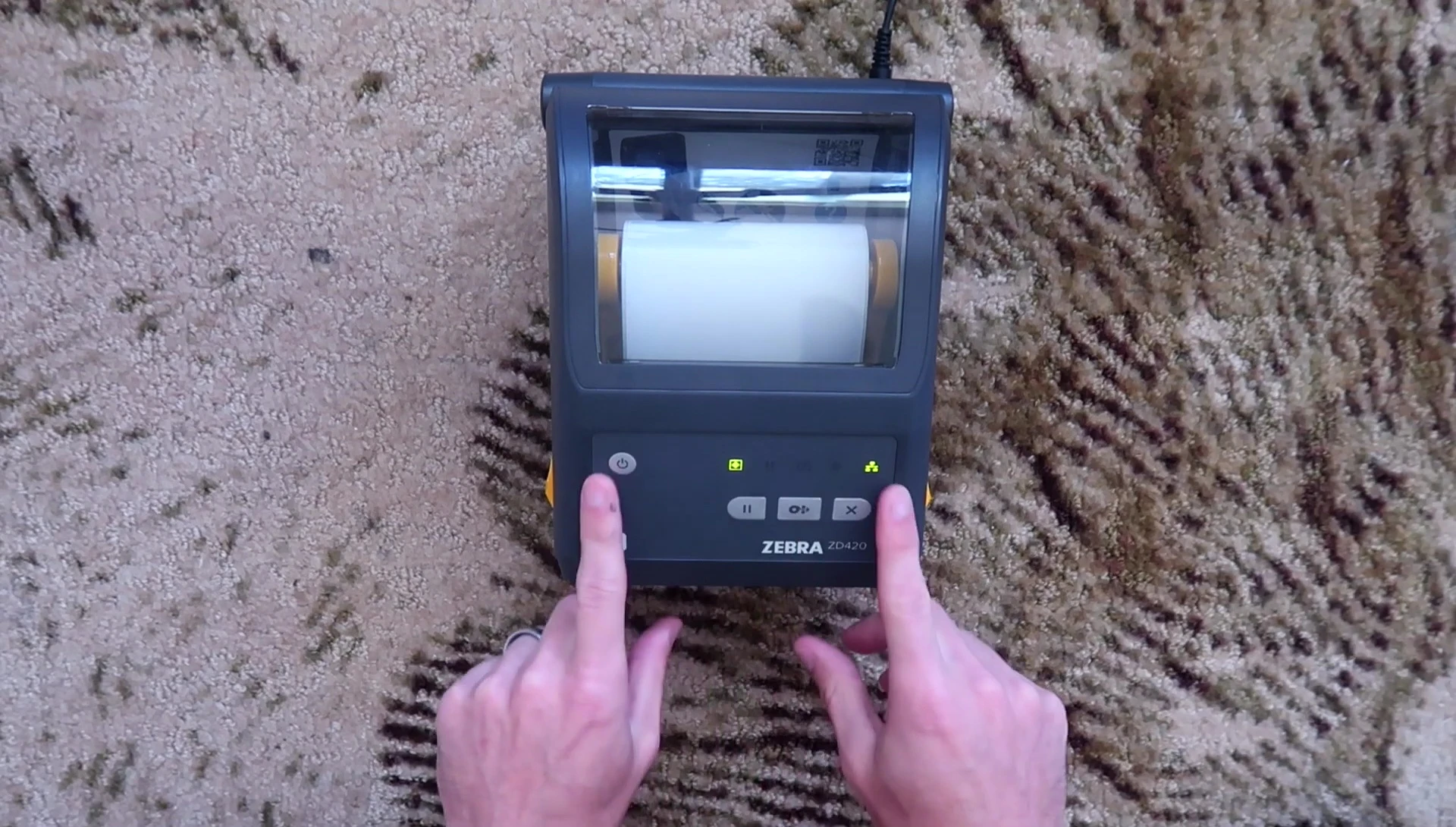 Top view of the printer showcasing the control panel with buttons and LED indicators.